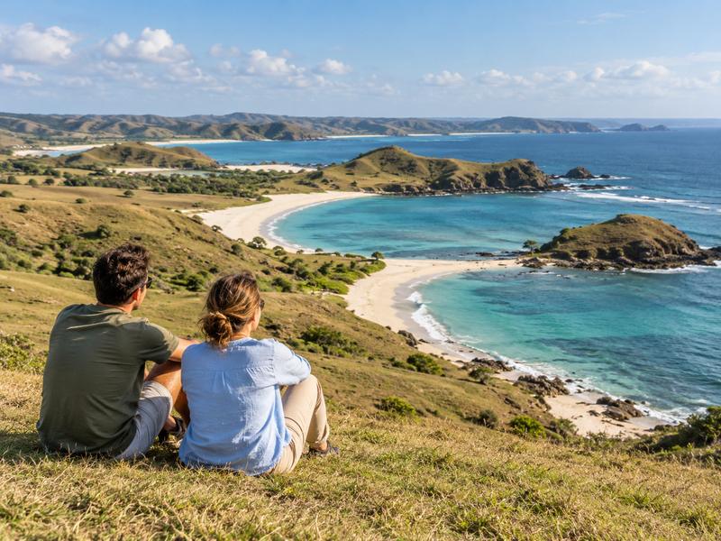 Couple enjoying the coastal view from Bukit Merese