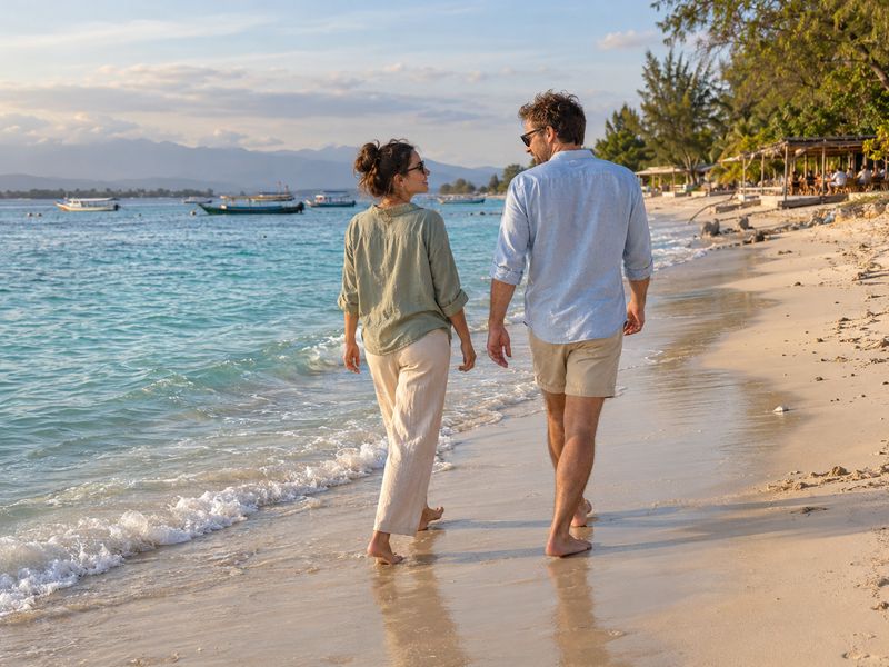 Couple walking beside the beach on Gili Trawangan