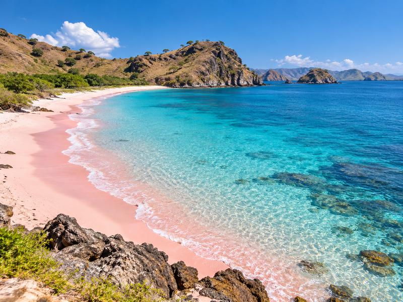 Scenic coastline and clear blue water at Pink Beach in East Lombok
