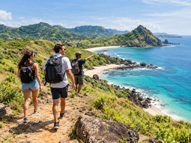Travelers exploring the coastline during a Lombok day tour